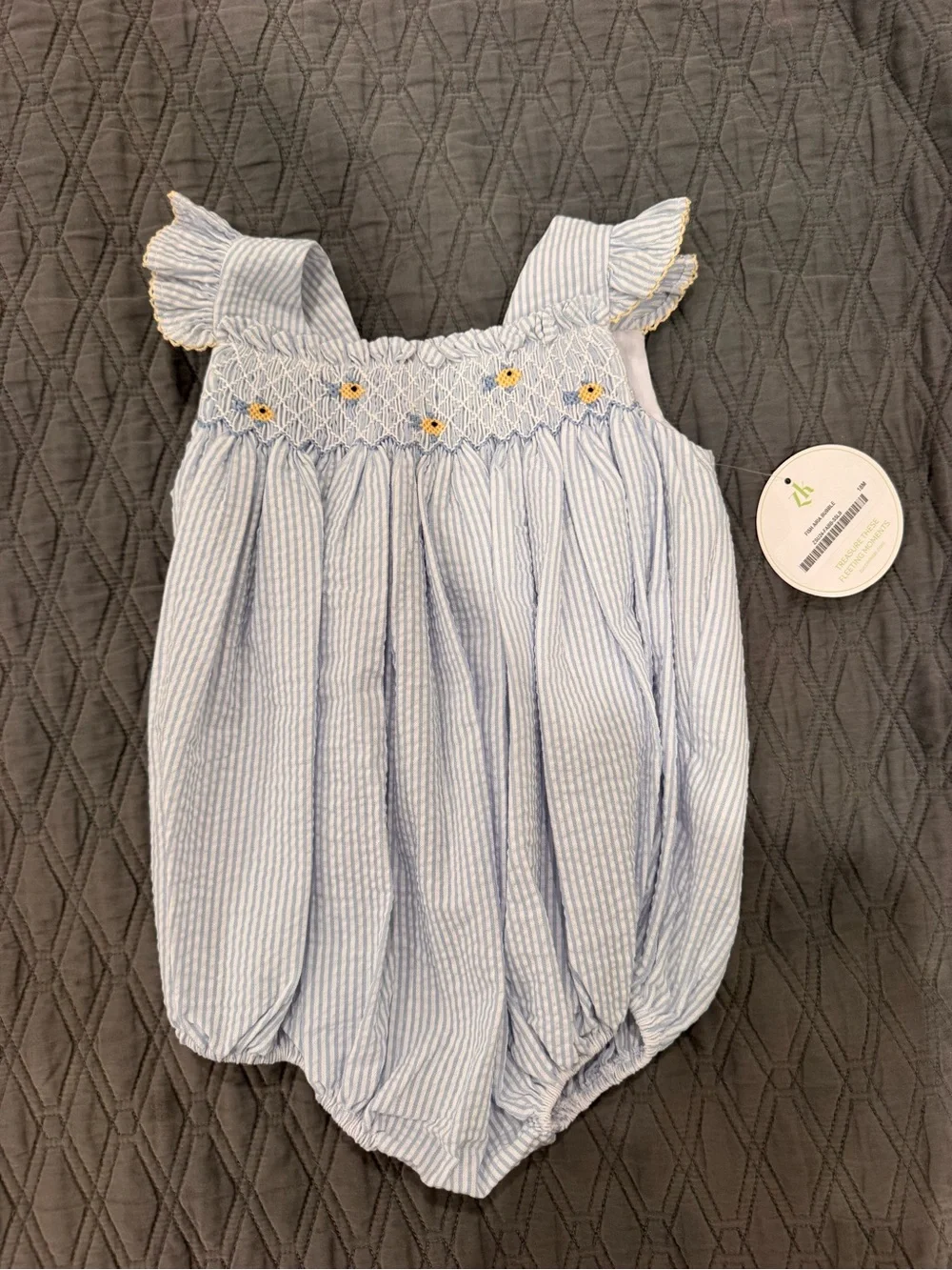 Blue Seersucker Smocked Baby One-Piece with Yellow Flower Detail